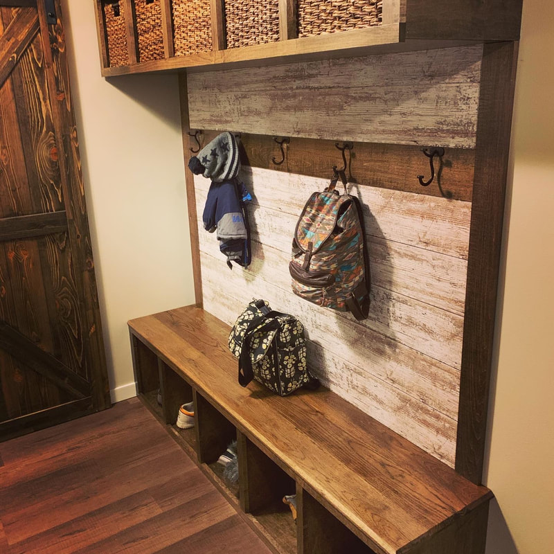 Need mudroom storage ideas? Here is a great mudroom storage with shelving, seating, coat hangers, cubbies and all the storage from your entire family. Entry ways can be organized with built in shelving and seating. Custom built for a entry way remodeling project on a budget in Spicer, MN. 