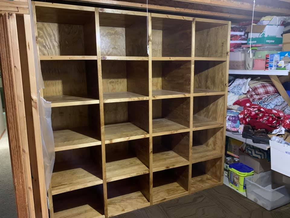 Custom built wood shelving and storage for a basement storage room in St. Joseph, MN