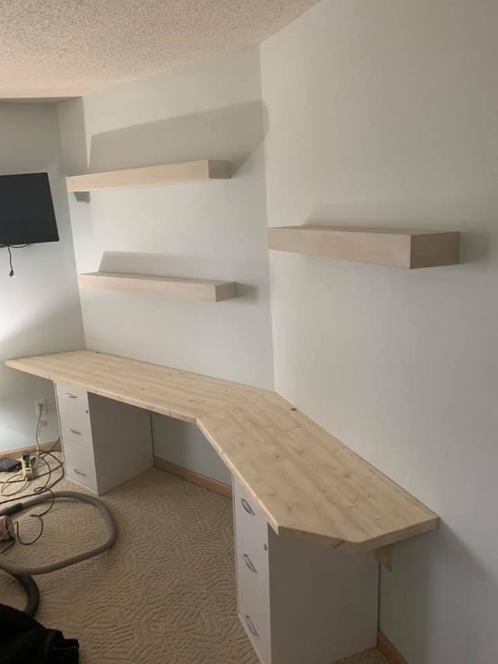 custom wood shelving and wood desk. floating shelving. storage. office furniture.