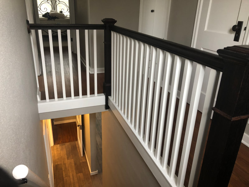 Wood railings can truly enhance any home decor. With endless design ideas we can create wood railings and stairs that match modern home designs, rustic home designs or traditional home designs. Painted or stained wood railings made from oak are very common. We also build wood railings with pine and other wood species to match existing woodwork throughout your home. This wood railing was installed in a home in Avon, MN, near Albany, MN.