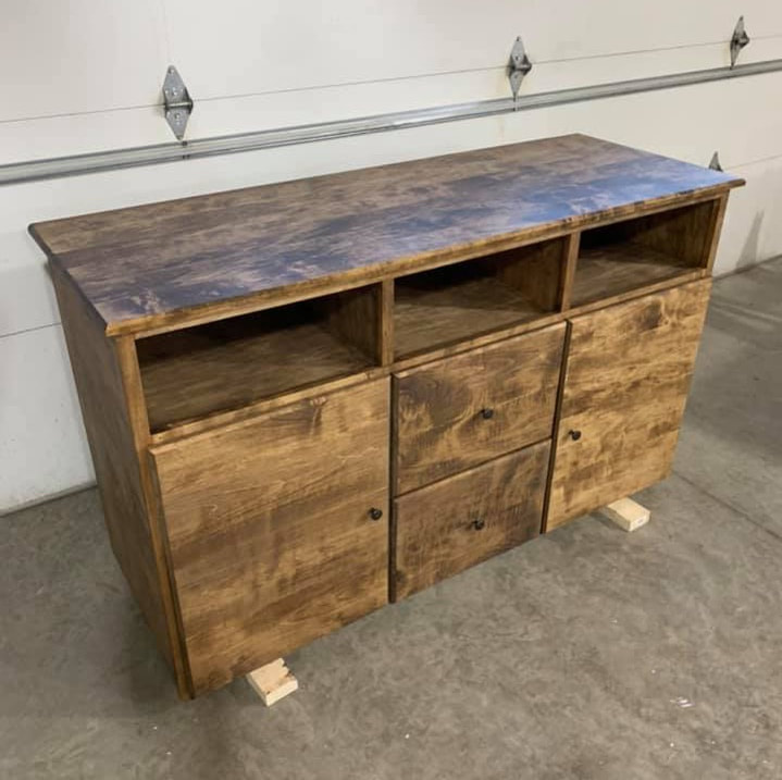 Wood entertainment center for organizing your TV and electronics. Painted black to match a modern home design, this custom wood entertainment center goes great in any home. This featured piece of wood furniture was built for a homeowner in Cold Spring, MN.