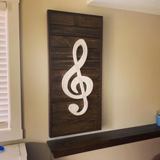 Custom wood home decor for the musician in your family. This home decor piece was crafted from pine, so it was very affordable and built to meet a tight budget. Stained wood decor is a great way to enhance and complement any home design. This wood decor was created for a homeowner in Sauk Centre, Minnesota.