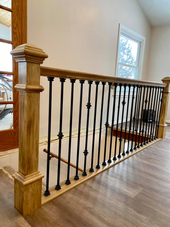 Interior wood stairs railing, custom built, metal spindles, wood railings for stairs and steps inside a home, great idea for home remodeling project